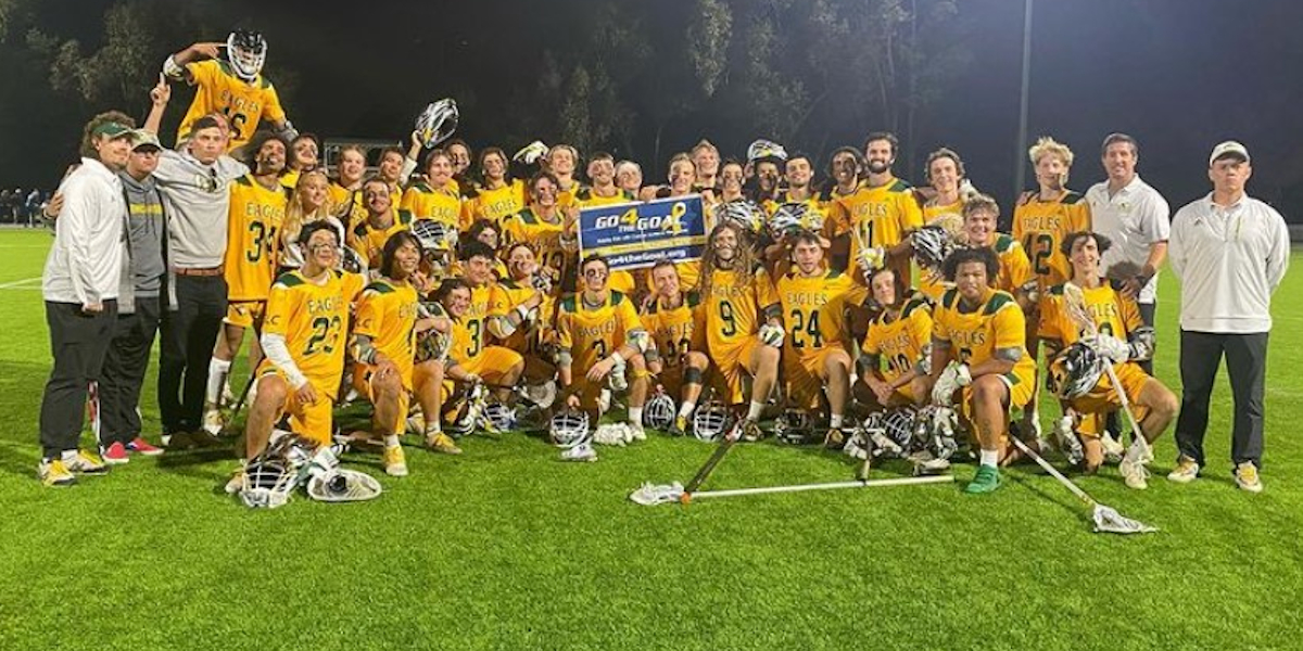 Men’s lacrosse team celebrates a win during their successful season